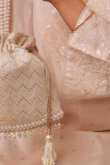 Buy_Amyra_Off White Embroidery, Pearls, Tassels, Metallic Thread Mayuri Potli _Online_at_Aza_Fashions