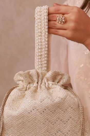 Shop_Amyra_Off White Embroidery, Pearls, Tassels, Metallic Thread Mayuri Potli _Online_at_Aza_Fashions