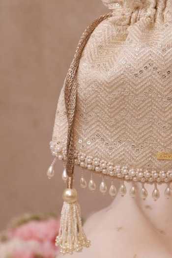 Amyra_Off White Embroidery, Pearls, Tassels, Metallic Thread Mayuri Potli _at_Aza_Fashions