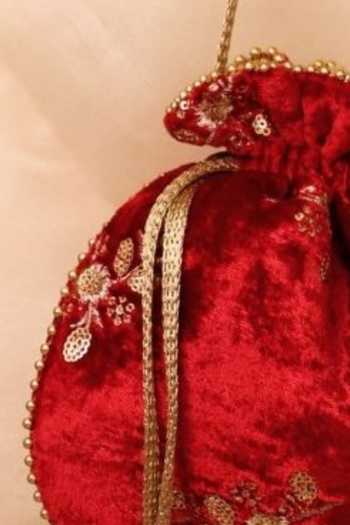 Shop_Amyra_Red Embroidery, Beads, Zari, Tassels Ras Velvet Potli _Online_at_Aza_Fashions