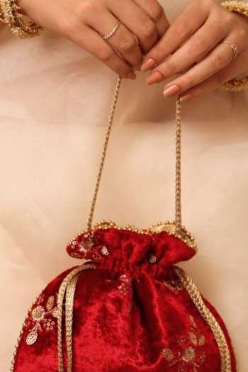 Amyra_Red Embroidery, Beads, Zari, Tassels Ras Velvet Potli _at_Aza_Fashions
