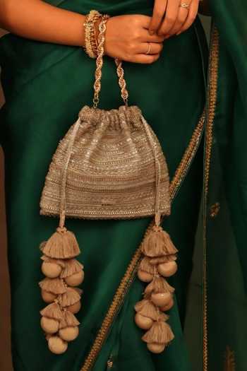 Buy AMYRA Gold Zari, Tassels, Lace Ekaya Textured Pattern Potli Online at Aza Fashions Buy_AMYRA_Gold Zari, Tassels, Lace Ekaya Textured Pattern Potli _Online_at_Aza_Fashions