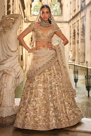 Seema Gujral_Beige Net Embroidery, Pearls, Sequins, Tassels Sweetheart Bridal Lehenga Set _at_Aza_Fashions