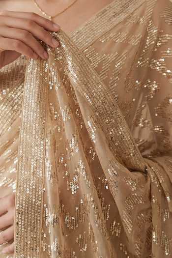 Shop_Two Sisters By Gyans_Gold Georgette Bandeau Neck Sequin Embellished Saree And Unstitched Blouse Set _Online_at_Aza_Fashions