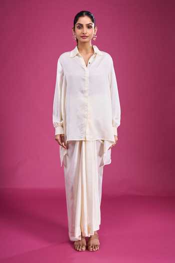 Aseem Kapoor Ivory Embroidery, Mirrors, Tassels Collared Overlay And Draped Skirt Set at Aza Fashions Aseem Kapoor_Ivory Embroidery, Mirrors, Tassels Collared Overlay And Draped Skirt Set _at_Aza_Fashions