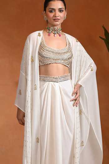 Rishi and Vibhuti_Ivory Cotton, Organza, Georgette, Crepe, Karl Embroidered Shrug Draped Skirt Set _Online_at_Aza_Fashions