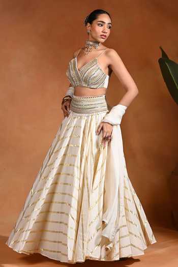 Buy Rishi and Vibhuti Ivory Cotton, Organza, Jacquard, Lurex V-neck Zar Embroidered Lehenga Set Online at Aza Fashions Buy_Rishi and Vibhuti_Ivory Cotton, Organza, Jacquard, Lurex V-neck Zar Embroidered Lehenga Set _Online_at_Aza_Fashions