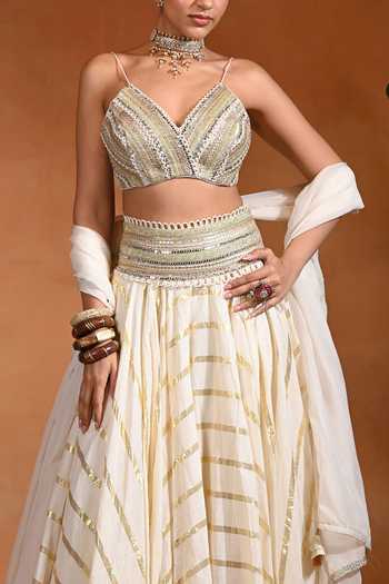 Shop Rishi and Vibhuti Ivory Cotton, Organza, Jacquard, Lurex V-neck Zar Embroidered Lehenga Set Online at Aza Fashions Shop_Rishi and Vibhuti_Ivory Cotton, Organza, Jacquard, Lurex V-neck Zar Embroidered Lehenga Set _Online_at_Aza_Fashions