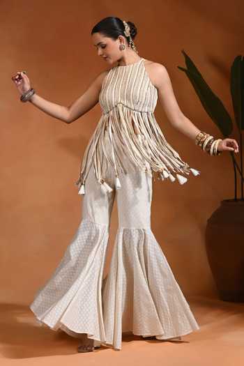 Shop Rishi and Vibhuti Ivory Cotton, Jacquard Halter Neck, Yes Chamcham Tassel Peplum Kurta Sharara Set Online at Aza Fashions Shop_Rishi and Vibhuti_Ivory Cotton, Jacquard Halter Neck, Yes Chamcham Tassel Peplum Kurta Sharara Set _Online_at_Aza_Fashions