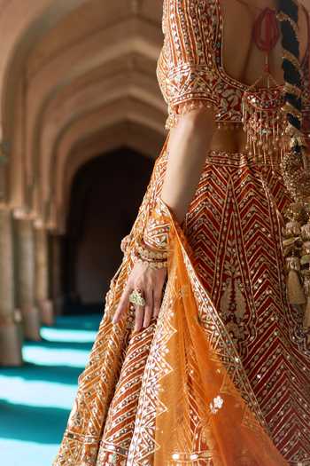 Shop ANGAD SINGH Orange Organza V-neck Tej Embroidered Lehenga Set Shop_ANGAD SINGH_Orange Organza V-neck Tej Embroidered Lehenga Set