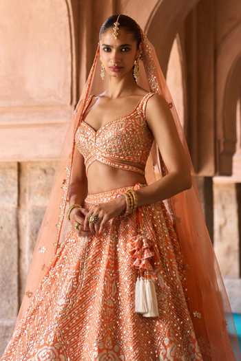 Shop ANGAD SINGH Orange Silk Sweetheart Neck Suraj Mirror Embroidered Raw Lehenga Set Online at Aza Fashions Shop_ANGAD SINGH_Orange Silk Sweetheart Neck Suraj Mirror Embroidered Raw Lehenga Set _Online_at_Aza_Fashions