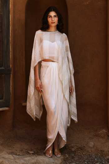 Buy HOUSE OF TA-YA Off White Crepe, Satin, Modal Sheer Organza Cape Skirt Set Online at Aza Fashions Buy_HOUSE OF TA-YA_Off White Crepe, Satin, Modal Sheer Organza Cape Skirt Set _Online_at_Aza_Fashions