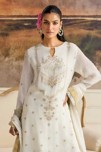 RINESSA Ivory Organza, Cotton Satin Round Neck Amara Embellished Kurta Gharara Set Online at Aza Fashions RINESSA_Ivory Organza, Cotton Satin Round Neck Amara Embellished Kurta Gharara Set _Online_at_Aza_Fashions