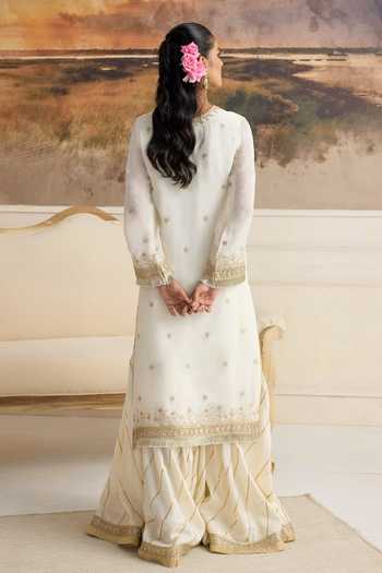 Shop RINESSA Ivory Organza, Cotton Satin Round Neck Amara Embellished Kurta Gharara Set at Aza Fashions Shop_RINESSA_Ivory Organza, Cotton Satin Round Neck Amara Embellished Kurta Gharara Set _at_Aza_Fashions