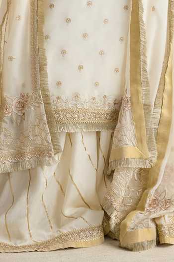 Buy RINESSA Ivory Organza, Cotton Satin Round Neck Amara Embellished Kurta Gharara Set Online at Aza Fashions Buy_RINESSA_Ivory Organza, Cotton Satin Round Neck Amara Embellished Kurta Gharara Set _Online_at_Aza_Fashions
