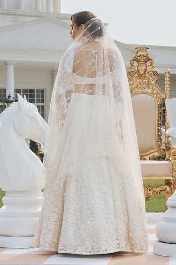 RINESSA_Ivory Net Sweetheart Neck Hand Embroidered Lehenga Set _at_Aza_Fashions