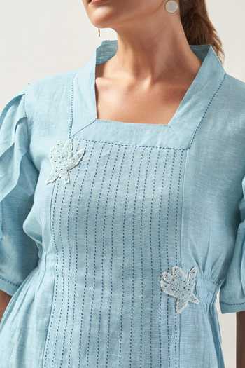 Shop Savaaya Blue Linen Square Neck The Cloud Flower Patched Pintucked Dress Online at Aza Fashions Shop_Savaaya_Blue Linen Square Neck The Cloud Flower Patched Pintucked Dress _Online_at_Aza_Fashions