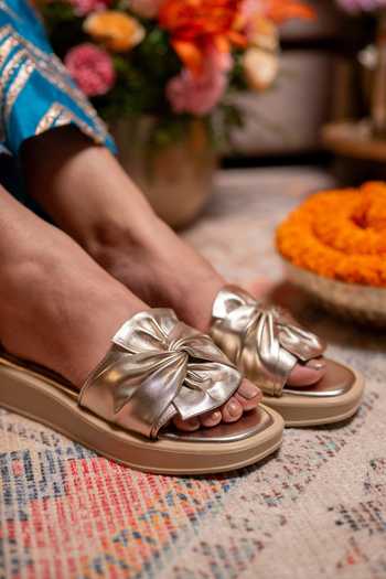 Coral Haze Gold Royce Knotted Broad Bow Strap Sliders Online at Aza Fashions Coral Haze_Gold Royce Knotted Broad Bow Strap Sliders _Online_at_Aza_Fashions