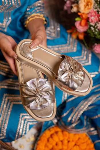 Buy Coral Haze Gold Royce Knotted Broad Bow Strap Sliders Online at Aza Fashions Buy_Coral Haze_Gold Royce Knotted Broad Bow Strap Sliders _Online_at_Aza_Fashions