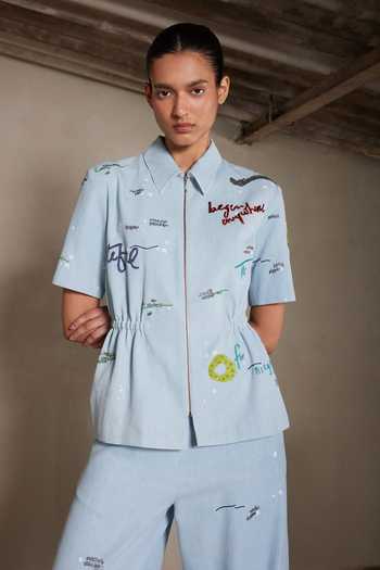 Shahin Mannan Blue Denim Collared Neck Art And Words Drawstring Top Online at Aza Fashions Shahin Mannan_Blue Denim Collared Neck Art And Words Drawstring Top _Online_at_Aza_Fashions