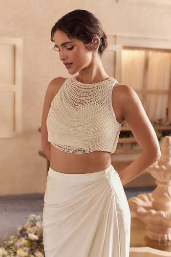 Buy Studio22 By Pulkita Arora Bajaj White Satin, Net Halter Neck Myra Beaded Crop Top With Draped Skirt Online at Aza Fashions Buy_Studio22 By Pulkita Arora Bajaj_White Satin, Net Halter Neck Myra Beaded Crop Top With Draped Skirt _Online_at_Aza_Fashions