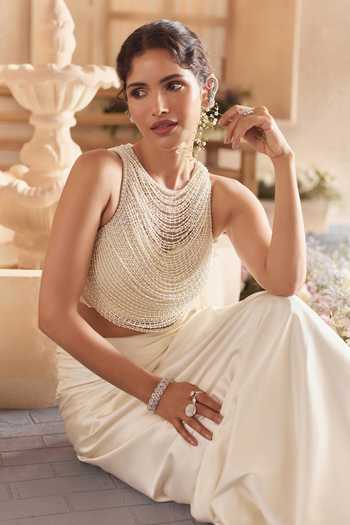 Shop Studio22 By Pulkita Arora Bajaj White Satin, Net Halter Neck Myra Beaded Crop Top With Draped Skirt Online at Aza Fashions Shop_Studio22 By Pulkita Arora Bajaj_White Satin, Net Halter Neck Myra Beaded Crop Top With Draped Skirt _Online_at_Aza_Fashions