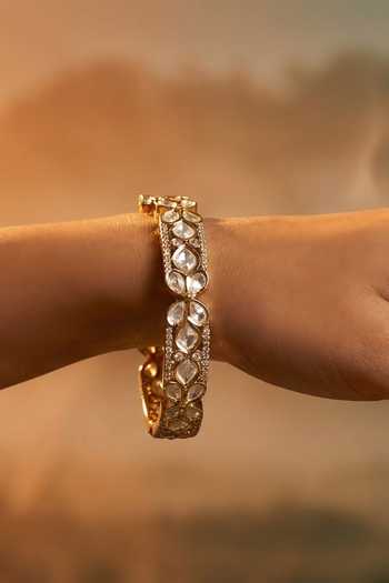 Tussya Gold Plated Kundan Carved Bangles - Set Of 2 Online at Aza Fashions Tussya_Gold Plated Kundan Carved Bangles - Set Of 2 _Online_at_Aza_Fashions