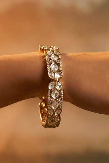 Buy Tussya Gold Plated Kundan Carved Bangles - Set Of 2 Online at Aza Fashions Buy_Tussya_Gold Plated Kundan Carved Bangles - Set Of 2 _Online_at_Aza_Fashions