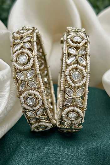 Buy_Tussya_Gold Plated Kundan Carved Bangles - Set Of 2  _Online_at_Aza_Fashions