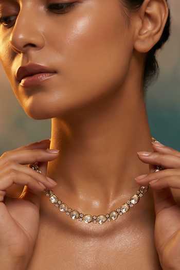 Tussya Gold Plated Stone Embellished Necklace And Earring Set at Aza Fashions Tussya_Gold Plated Stone Embellished Necklace And Earring Set _at_Aza_Fashions
