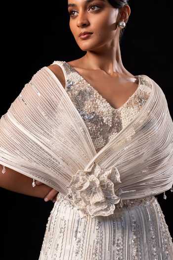 Smriti By Anju Agarwal Ivory Satin, Modal One Shoulder Embroidered Drape Attached Lehenga Set at Aza Fashions Smriti By Anju Agarwal_Ivory Satin, Modal One Shoulder Embroidered Drape Attached Lehenga Set _at_Aza_Fashions