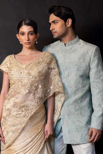 Smriti By Anju Agarwal Gold Tissue, Chinon Round Neck Serenity Embellished Drape Attached Lehenga Set at Aza Fashions Smriti By Anju Agarwal_Gold Tissue, Chinon Round Neck Serenity Embellished Drape Attached Lehenga Set _at_Aza_Fashions