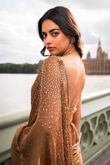 Seema Gujral_Gold Georgette Plunge Neck Crystal Embroidered Saree With Blouse _at_Aza_Fashions