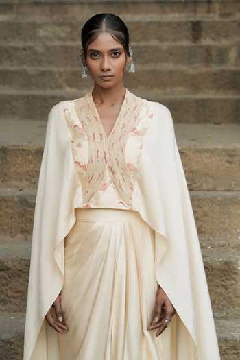 Buy Eraaya by Ratika J Beige Silk, Satin Shawl Neck Embroidered Cape Top With Skirt Online at Aza Fashions Buy_Eraaya by Ratika J_Beige Silk, Satin Shawl Neck Embroidered Cape Top With Skirt _Online_at_Aza_Fashions