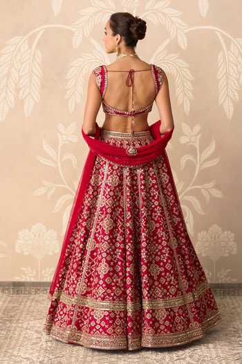 Shop Ridhi Mehra Red Silk, Net Sweetheart Neck Raw Embroidered Lehenga Set at Aza Fashions Shop_Ridhi Mehra_Red Silk, Net Sweetheart Neck Raw Embroidered Lehenga Set _at_Aza_Fashions