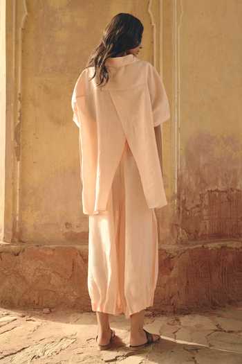 Shop Shop Nirvanaa Peach Linen Button-down Neck Amara Asymmetric Shirt at Aza Fashions Shop_Shop Nirvanaa_Peach Linen Button-down Neck Amara Asymmetric Shirt _at_Aza_Fashions