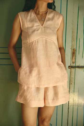Shop Nirvanaa_Peach Linen V-neck Roseline Top With Shorts _Online_at_Aza_Fashions