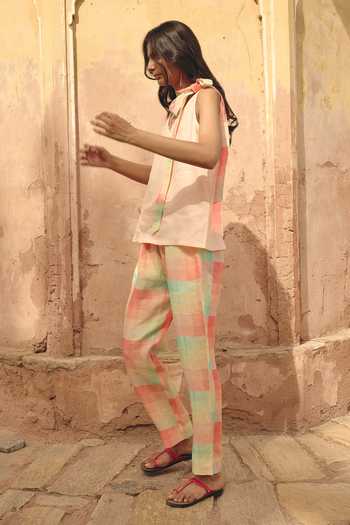 Shop Nirvanaa Peach Linen V-neck Nia Eda Tie Up Top And Pant Set at Aza Fashions Shop Nirvanaa_Peach Linen V-neck Nia Eda Tie Up Top And Pant Set _at_Aza_Fashions