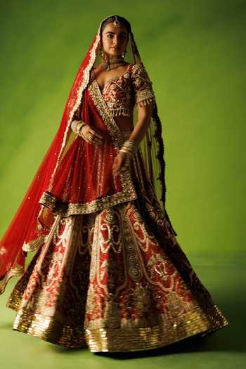 Kisakshi Jaipur Red Silk, Net V-neck Bridal Raw Embroidered Lehenga Set Online at Aza Fashions Kisakshi Jaipur_Red Silk, Net V-neck Bridal Raw Embroidered Lehenga Set _Online_at_Aza_Fashions