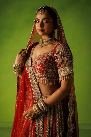 Kisakshi Jaipur Red Silk, Net V-neck Bridal Raw Embroidered Lehenga Set at Aza Fashions Kisakshi Jaipur_Red Silk, Net V-neck Bridal Raw Embroidered Lehenga Set _at_Aza_Fashions