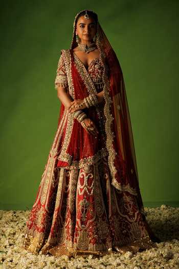 Buy Kisakshi Jaipur Red Silk, Net V-neck Bridal Raw Embroidered Lehenga Set Buy_Kisakshi Jaipur_Red Silk, Net V-neck Bridal Raw Embroidered Lehenga Set