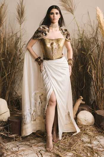 Shop ASHNA VASWANI Gold Crepe, Chanderi, Satin Metallic Thread Bandeau Neck Cape And Corset Set Online at Aza Fashions Shop_ASHNA VASWANI_Gold Crepe, Chanderi, Satin Metallic Thread Bandeau Neck Cape And Corset Set _Online_at_Aza_Fashions