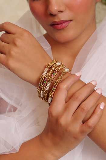 Prestones_Gold Plated Traditional Twisted Floral Bangles - Set Of 4 _Online_at_Aza_Fashions