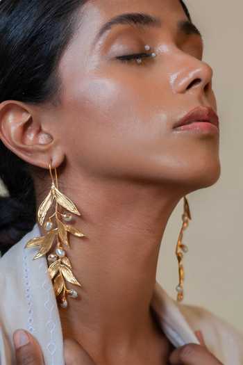 Buy Dhwani Bansal Jewellery Gold Plated Isaro Leaf Motif Earrings at Aza Fashions Buy_Dhwani Bansal Jewellery_Gold Plated Isaro Leaf Motif Earrings _at_Aza_Fashions