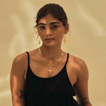 Dhwani Bansal Jewellery Gold Plated Cruz Cross Pendant Necklace at Aza Fashions Dhwani Bansal Jewellery_Gold Plated Cruz Cross Pendant Necklace _at_Aza_Fashions