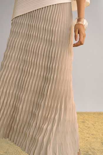 Dash And Dot Beige Polyester Round Neck Asymmetric Pleated Top And Skirt Set at Aza Fashions Dash And Dot_Beige Polyester Round Neck Asymmetric Pleated Top And Skirt Set _at_Aza_Fashions