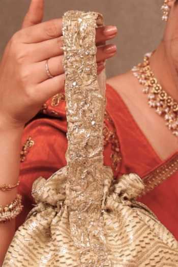 Buy Amyra Gold Embroidery, Beads, Zari, Tassels Sunehri Top Handle Potli Buy_Amyra_Gold Embroidery, Beads, Zari, Tassels Sunehri Top Handle Potli