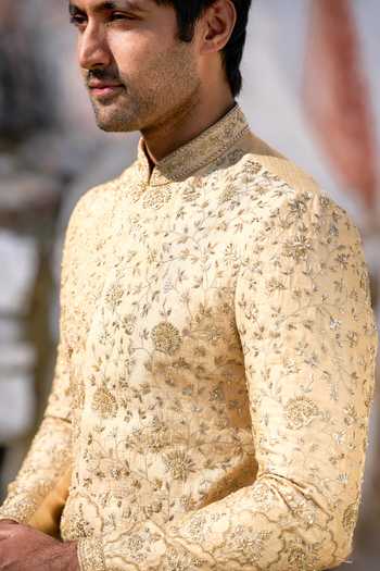 Tira by Naresh Raj_Gold Silk, Tissue Zari Heavy Embroidered Sherwani With Dhoti Pant _at_Aza_Fashions