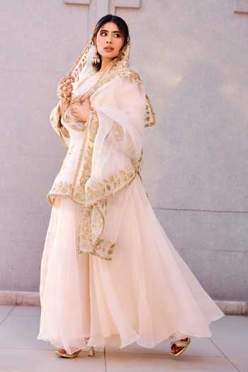 Charu Makkar Ivory Organza, Satin Round Neck, Yes Mumtaz Embroidered Kurta Sharara Set at Aza Fashions Charu Makkar_Ivory Organza, Satin Round Neck, Yes Mumtaz Embroidered Kurta Sharara Set _at_Aza_Fashions