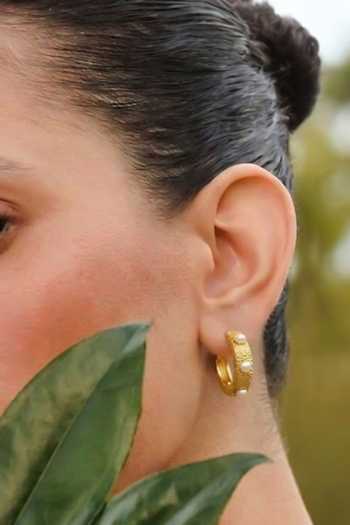 Arvino White Pearl Studded Textured Huggie Earrings at Aza Fashions Arvino_White Pearl Studded Textured Huggie Earrings _at_Aza_Fashions